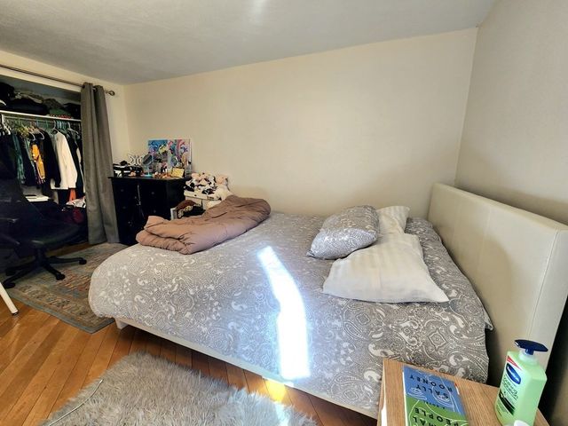 a bedroom with a bed and a walk in closet