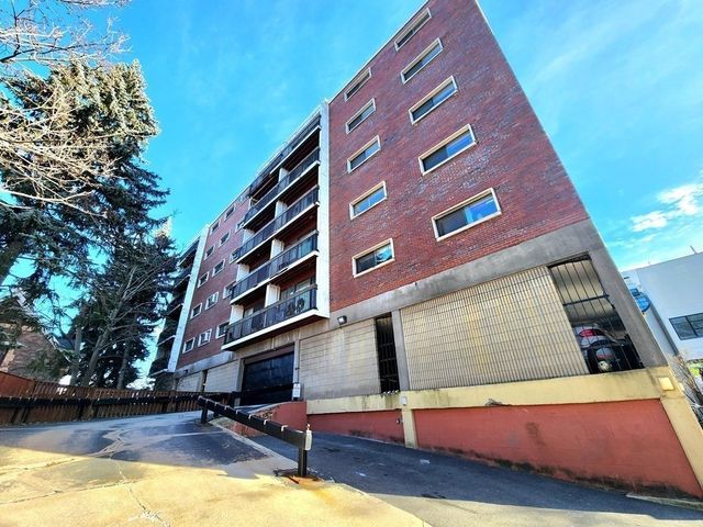 a view of pool with building in the background