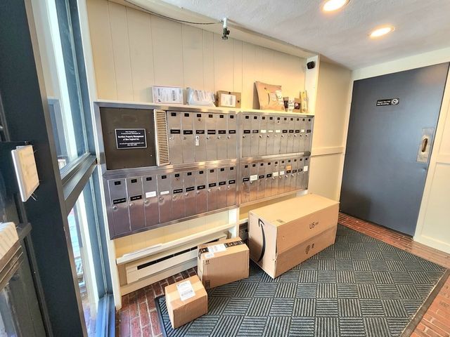 a view of living room with furniture and lamp