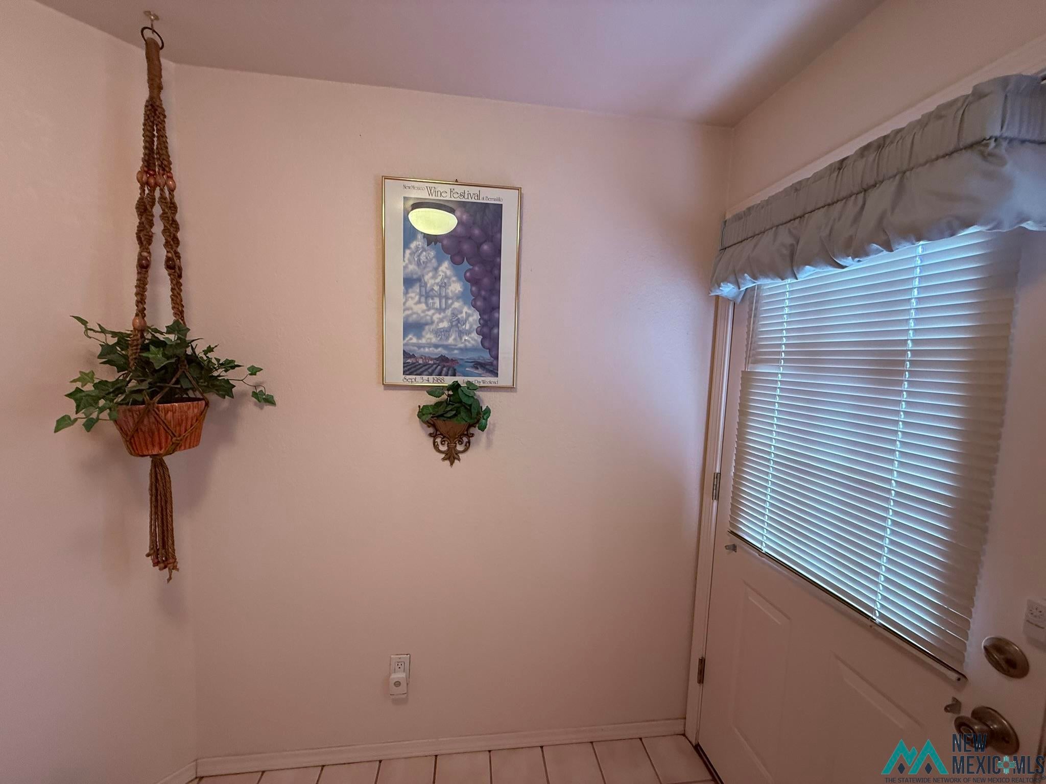 300 Rio Grande Circle Elephant Butte, NM 87935 - Photo 79 of 99 White panel door with horizontal blinds and a light-colored valance