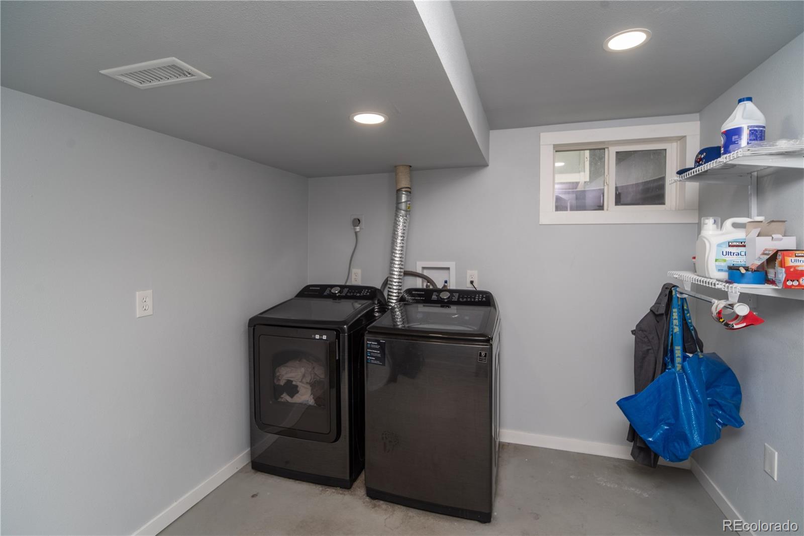 10879 West 65th Way Arvada, CO 80004 - Photo 15 of 41 a view of storage and utility room with toys