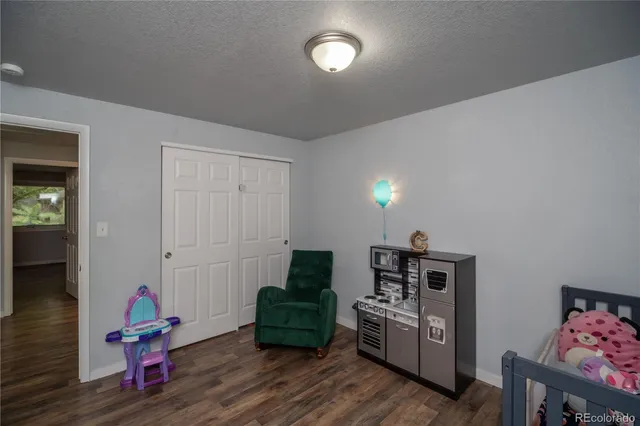 a bedroom with furniture and window