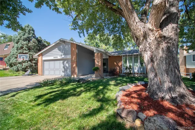 a house with a tree in front of it