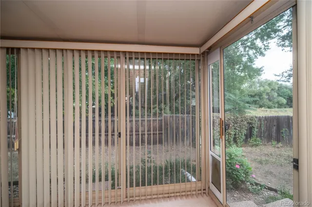 a view of a room with large windows