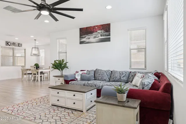 a kitchen with a sink a counter space appliances and cabinets