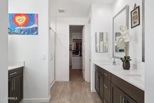 a bedroom with a bed and a dresser