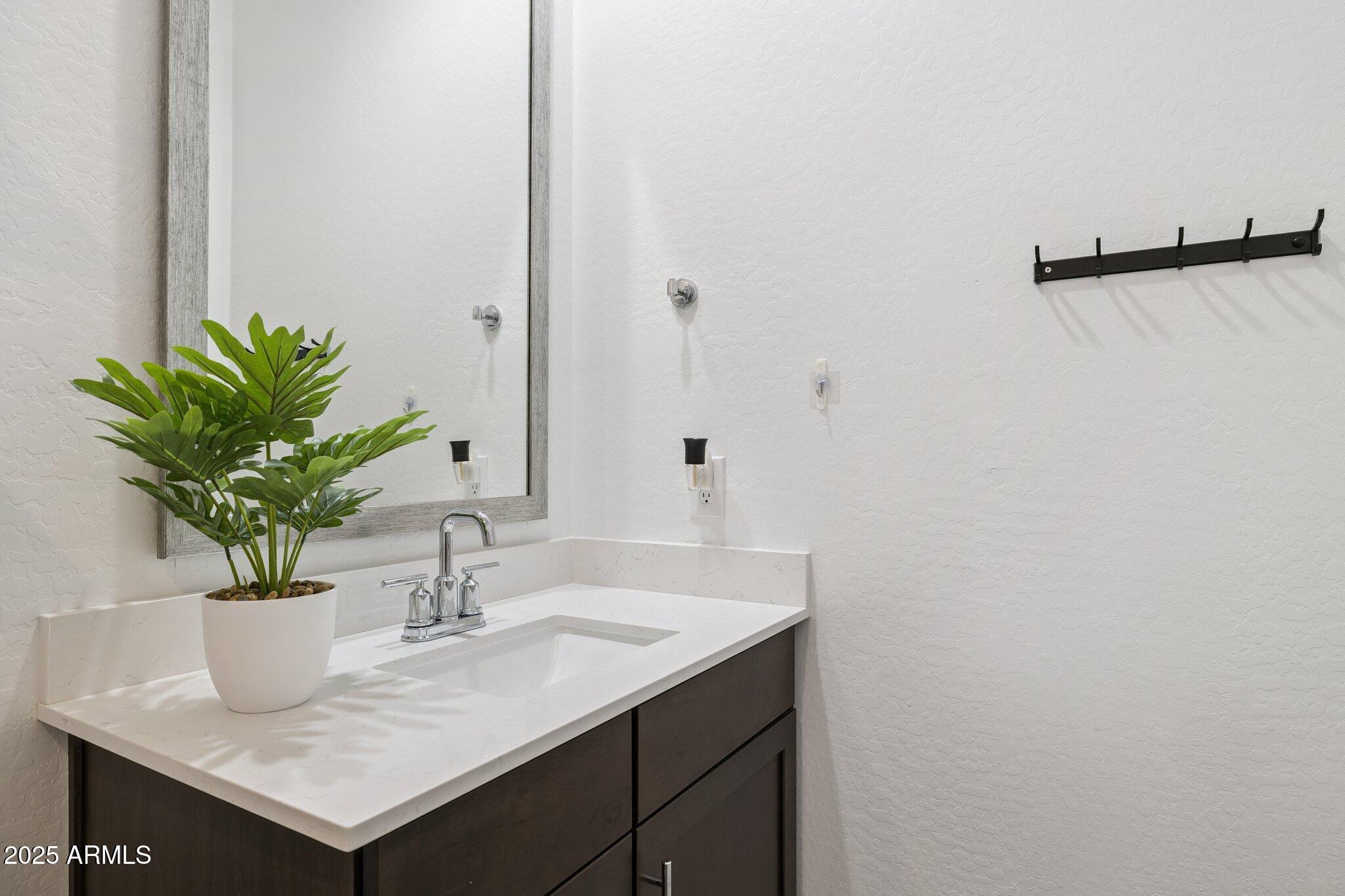 12347 East Soloman Road Gold Canyon, AZ 85118 - Photo 23 of 51 a bathroom with a sink and a mirror