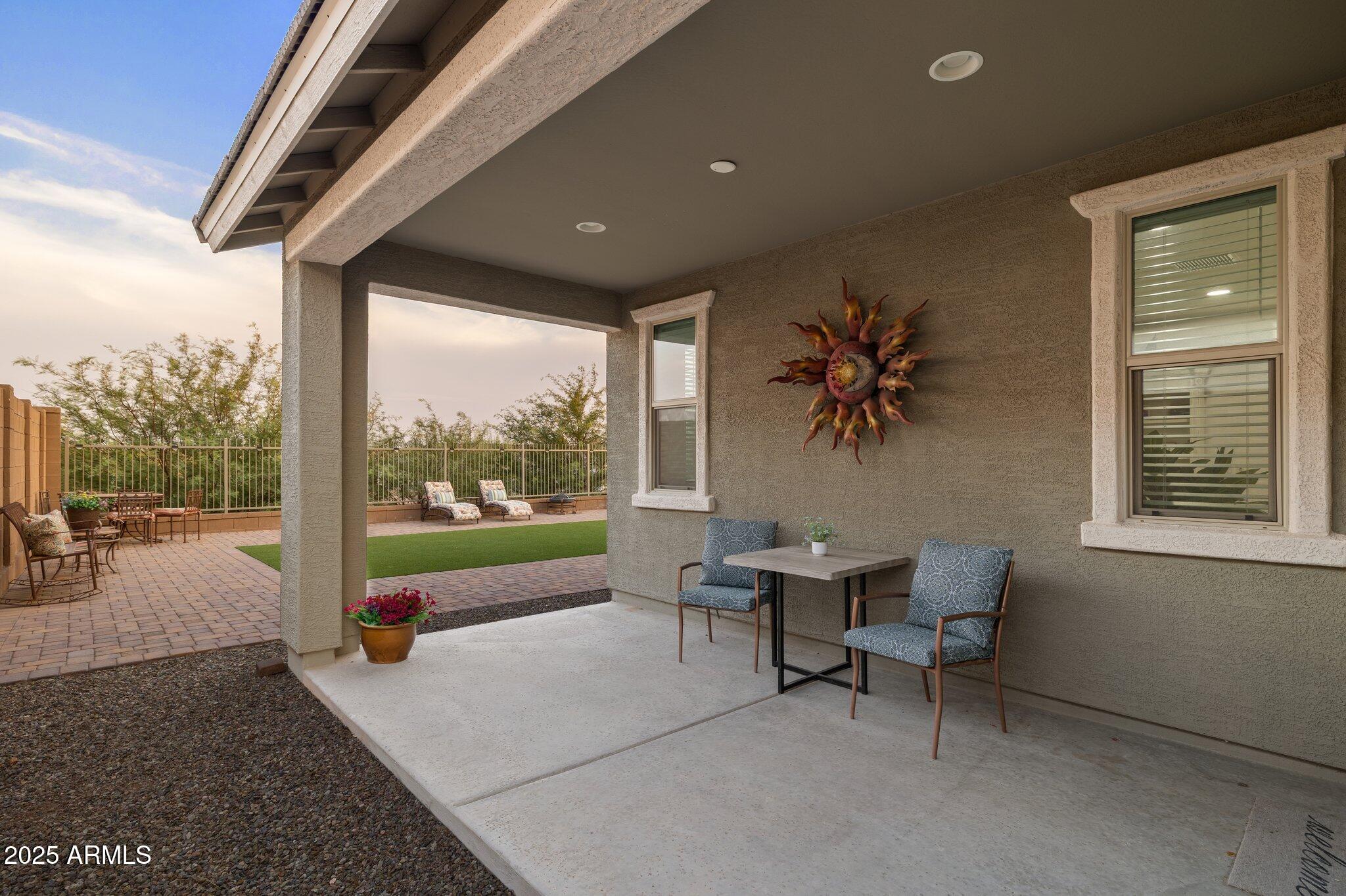 12347 East Soloman Road Gold Canyon, AZ 85118 - Photo 30 of 51 a view of a porch with furniture and a yard
