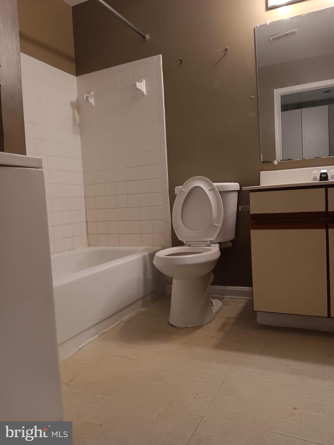 1647 Carriage House Terrace, Unit 1647C Silver Spring, MD 20904 - Photo 19 of 25 a bathroom with a toilet a sink and bathtub