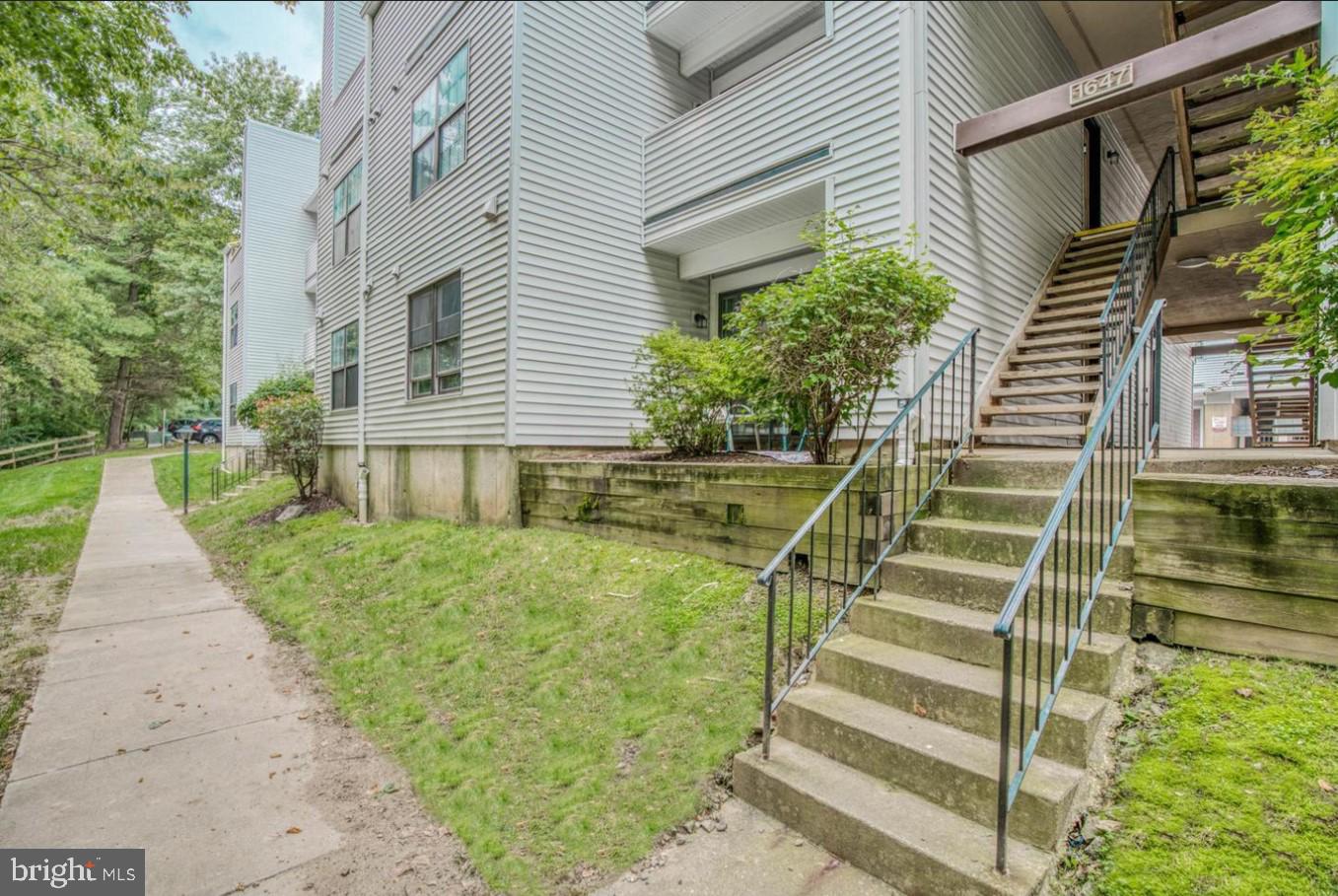 1647 Carriage House Terrace, Unit 1647C Silver Spring, MD 20904 - Photo 24 of 25 a front view of a house with a yard