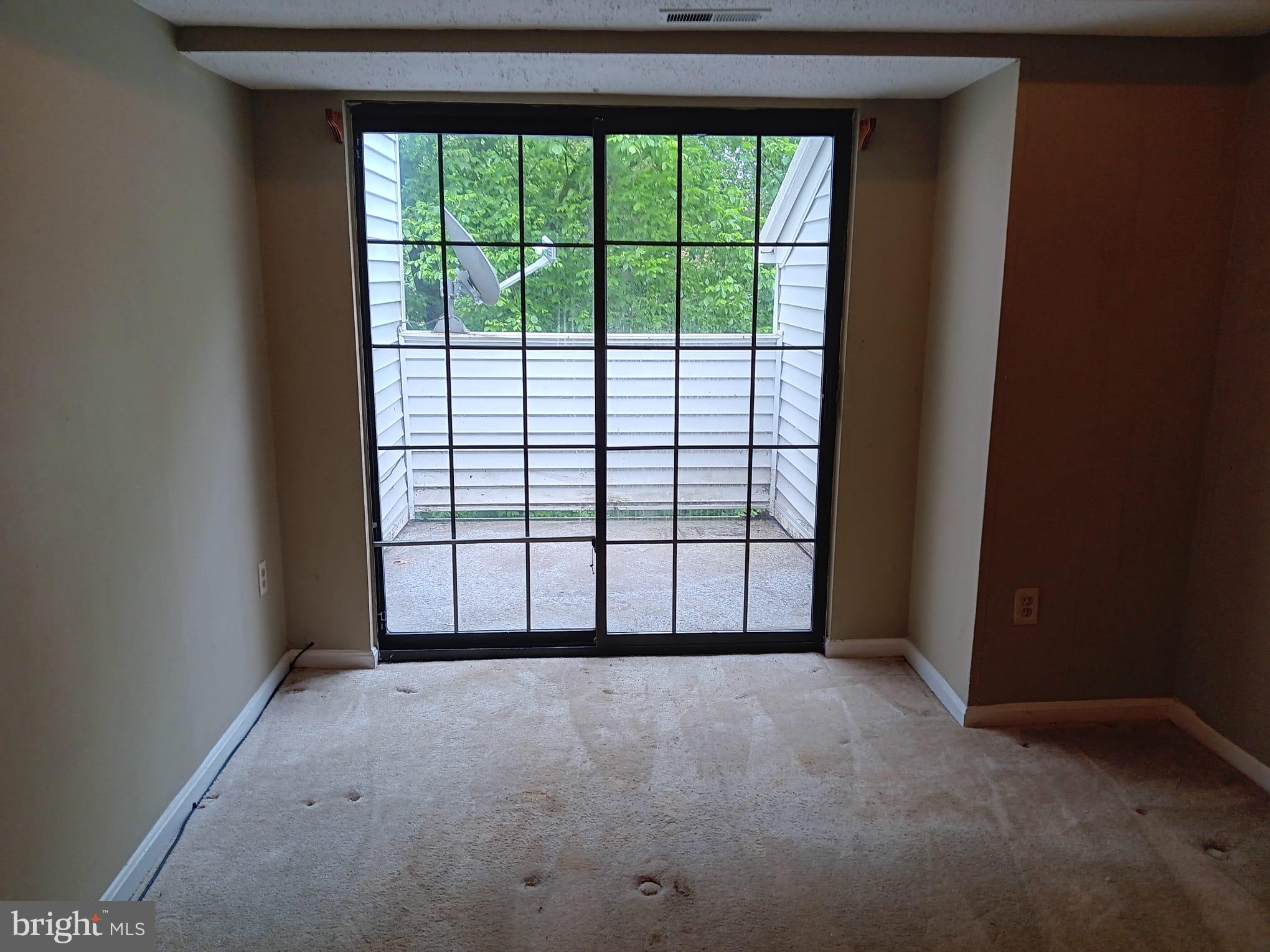 1647 Carriage House Terrace, Unit 1647C Silver Spring, MD 20904 - Photo 3 of 25 a view of a room that has a large window