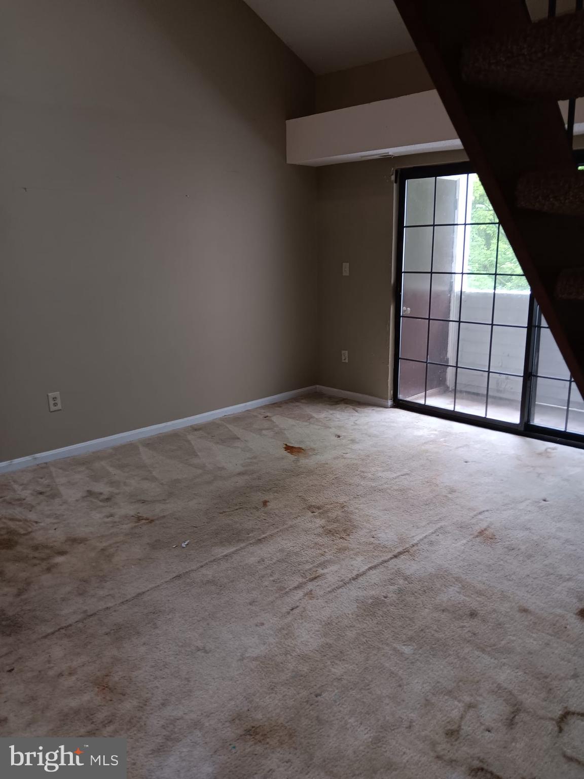 1647 Carriage House Terrace, Unit 1647C Silver Spring, MD 20904 - Photo 4 of 25 a view of an empty room with a window