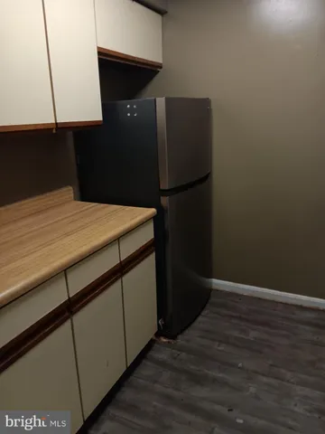 a kitchen with a sink and a refrigerator
