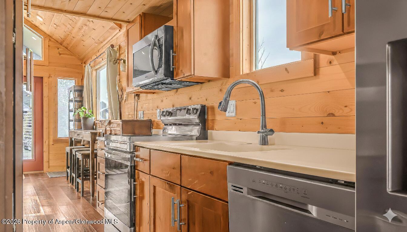 329 River Frontage Road, Unit 44 Silt, CO 81652 - Photo 2 of 17 a kitchen with stainless steel appliances granite countertop a sink and cabinets
