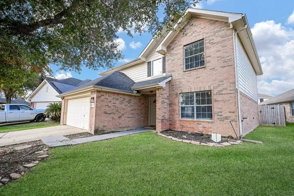 front view of a house with a yard