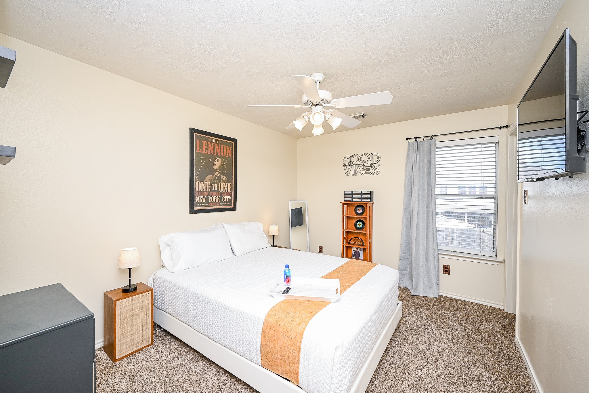 12122 Lucky Meadow Drive Tomball, TX 77375 - Photo 25 of 32 a bed room with a bed and a chandelier