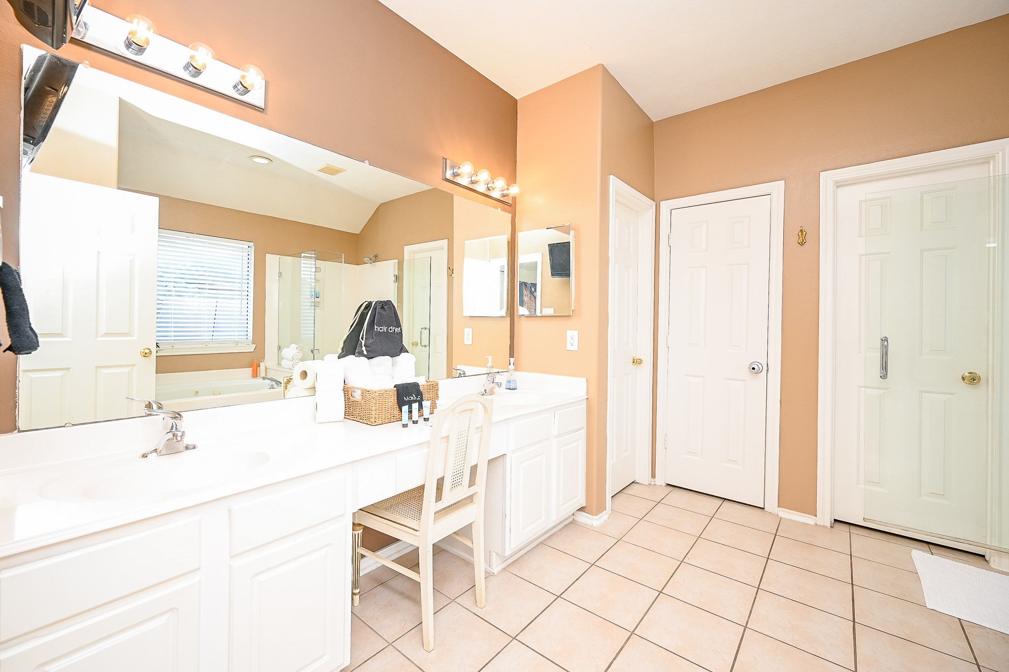 12122 Lucky Meadow Drive Tomball, TX 77375 - Photo 26 of 32 a kitchen with a sink a counter top space and cabinets