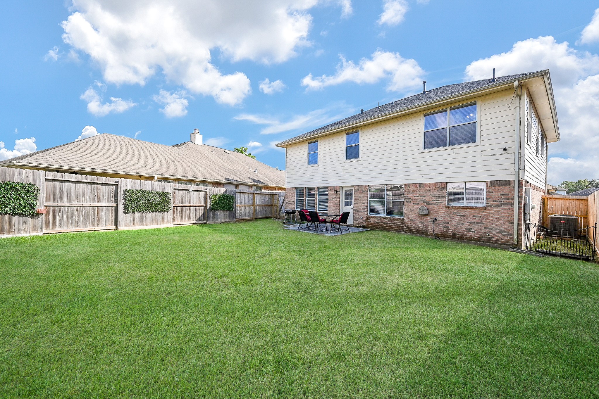 12122 Lucky Meadow Drive Tomball, TX 77375 - Photo 31 of 32 a view of an house with backyard space and balcony