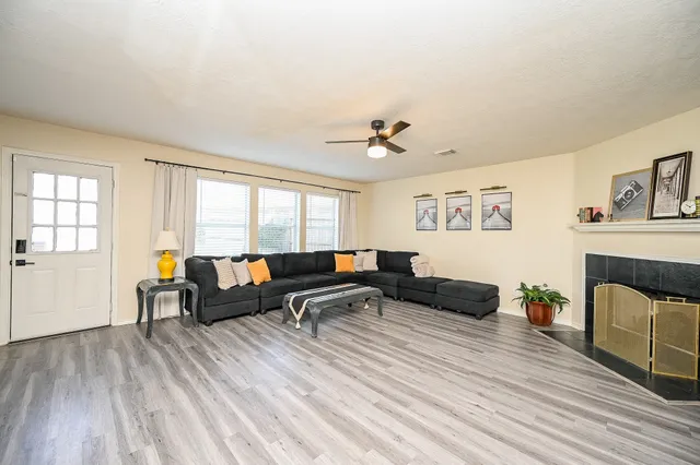 a living room with furniture and a fireplace