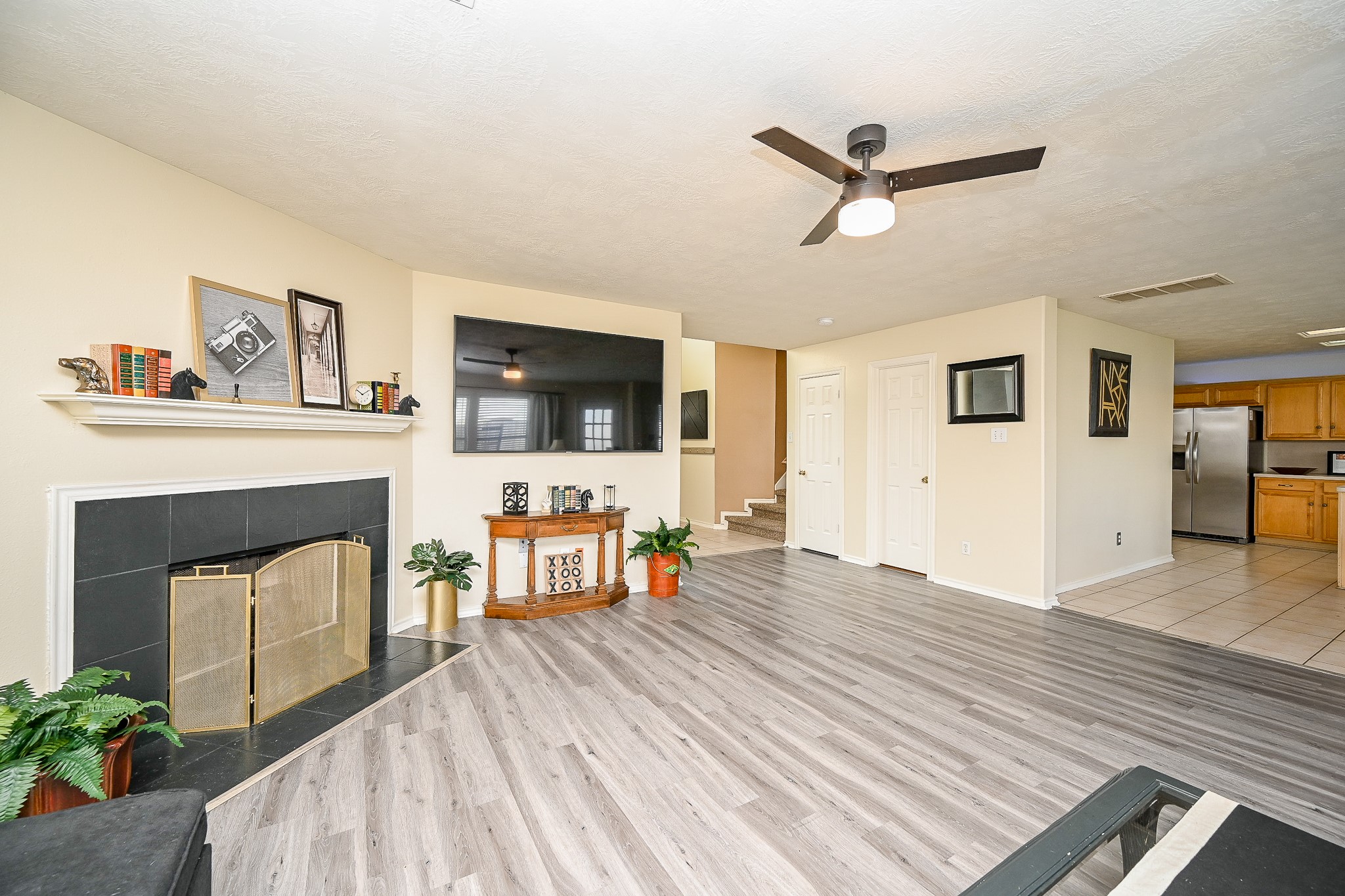 12122 Lucky Meadow Drive Tomball, TX 77375 - Photo 9 of 32 a living room with furniture and a fireplace