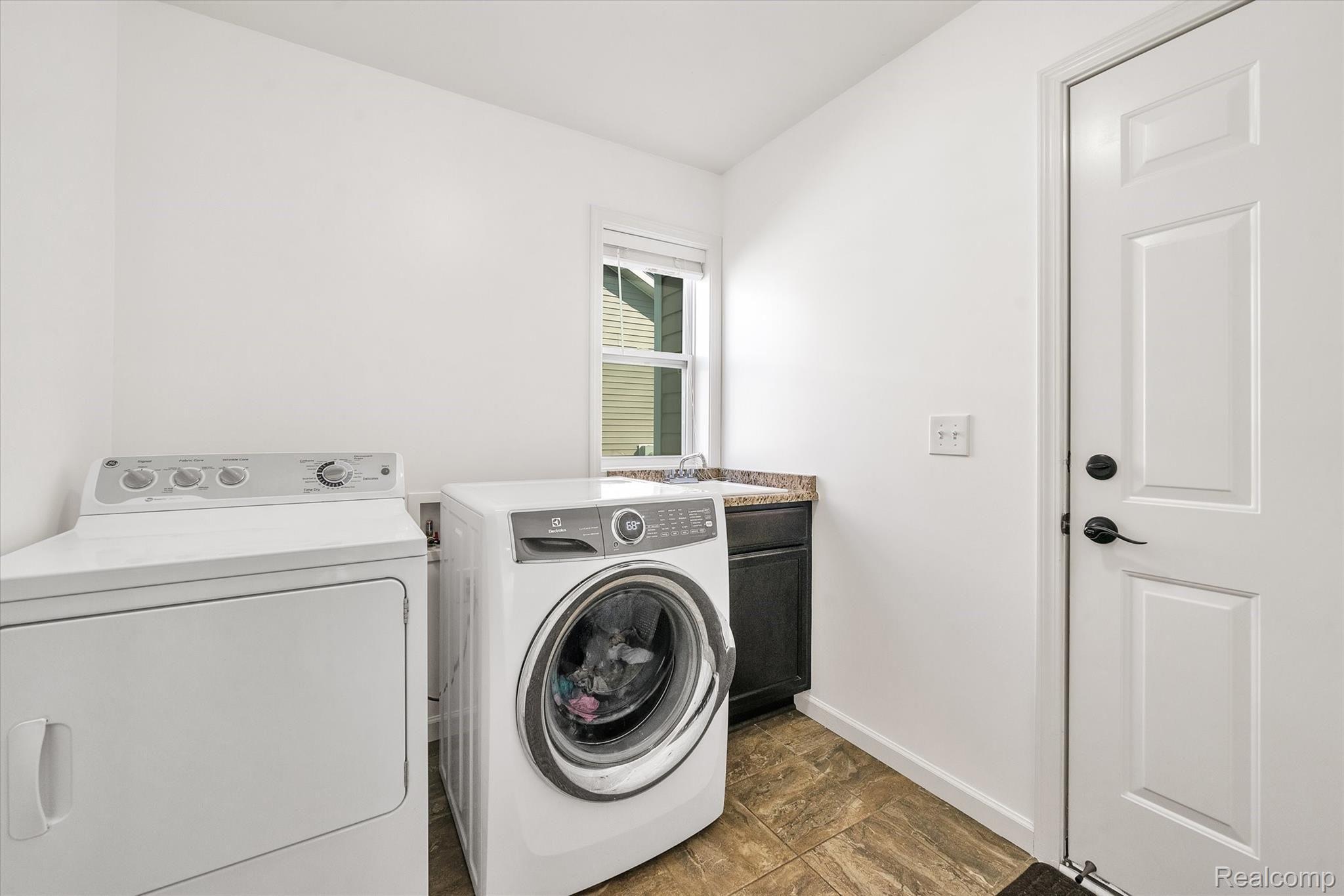 8116 Eagle Ridge Lane Fowlerville, MI 48836 - Photo 22 of 36 First Floor Laundry