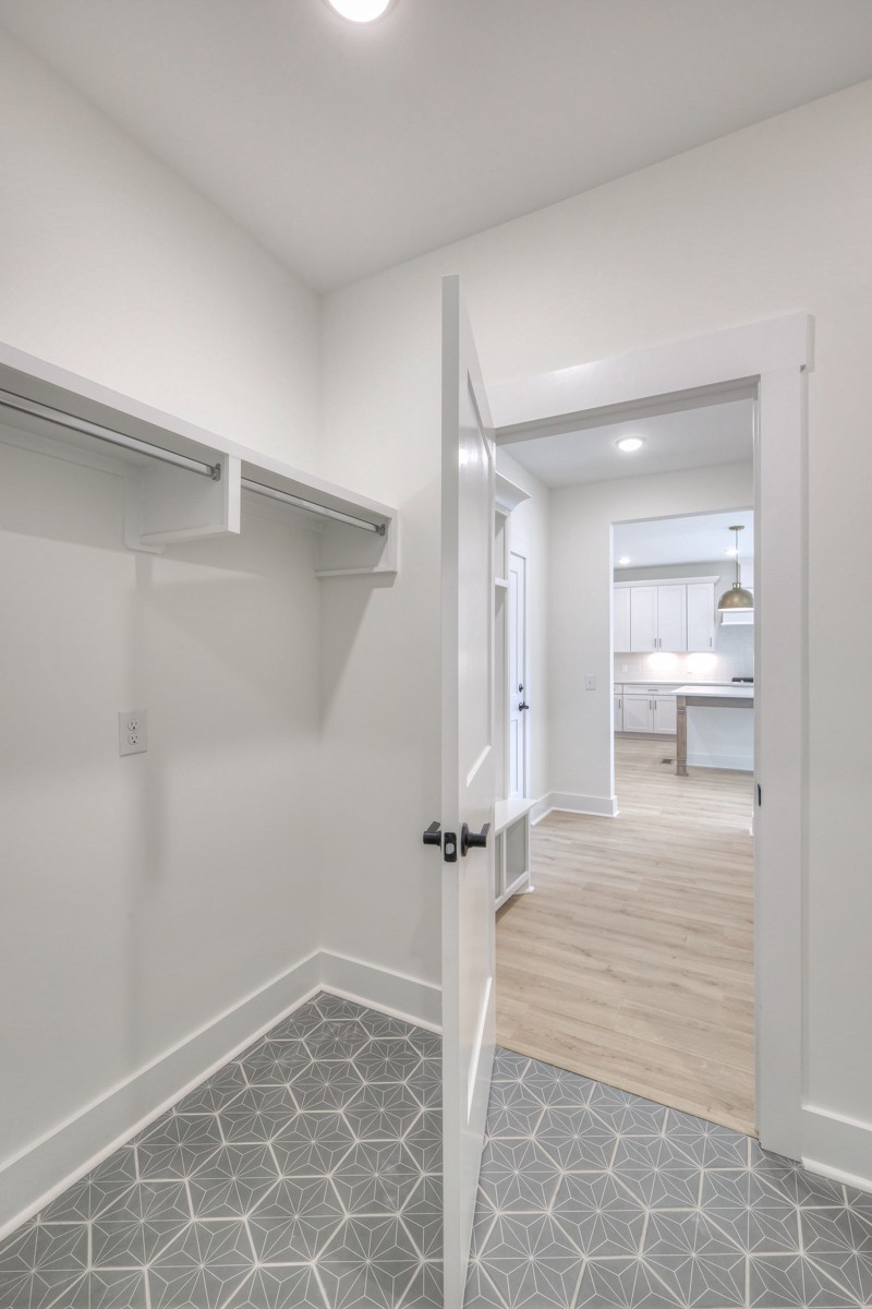 4044 John Marsh Road Spring Hill, TN 37174 - Photo 22 of 54 Laundry walkthrough from entertaining area to owners bed/bath.