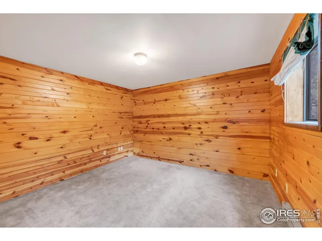 a view of hallway with stairs and furniture