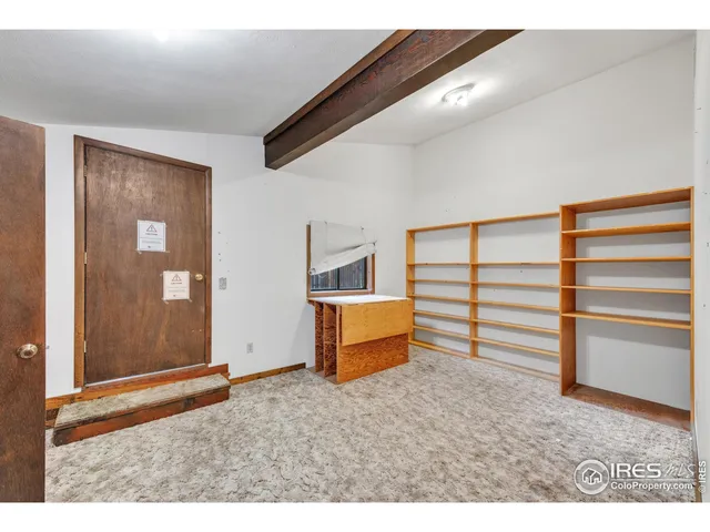 a view of room with furniture and wooden floor