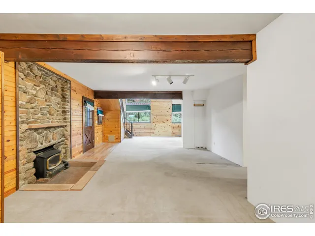 a view of living room with furniture and fireplace