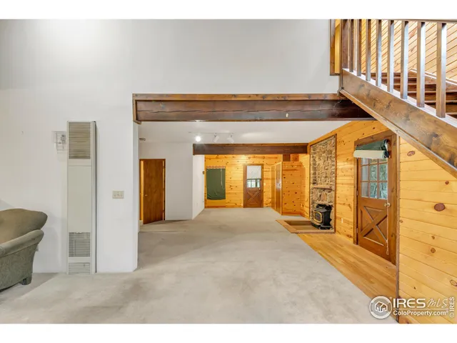 a view of an empty room and a window