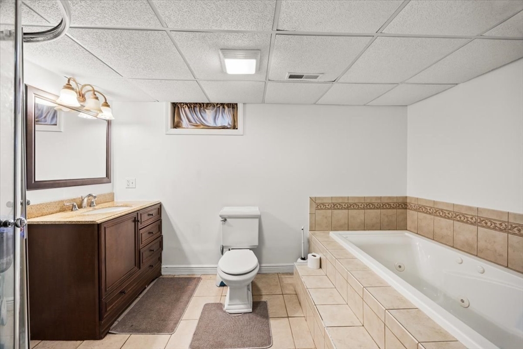 82 Midland Road Somerset, MA 02726 - Photo 23 of 28 a bathroom with a bathtub and sink