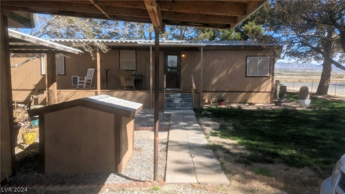 3530 North Blagg Road Pahrump, NV 89060 - Photo 2 of 27 Back of home with one car garage
