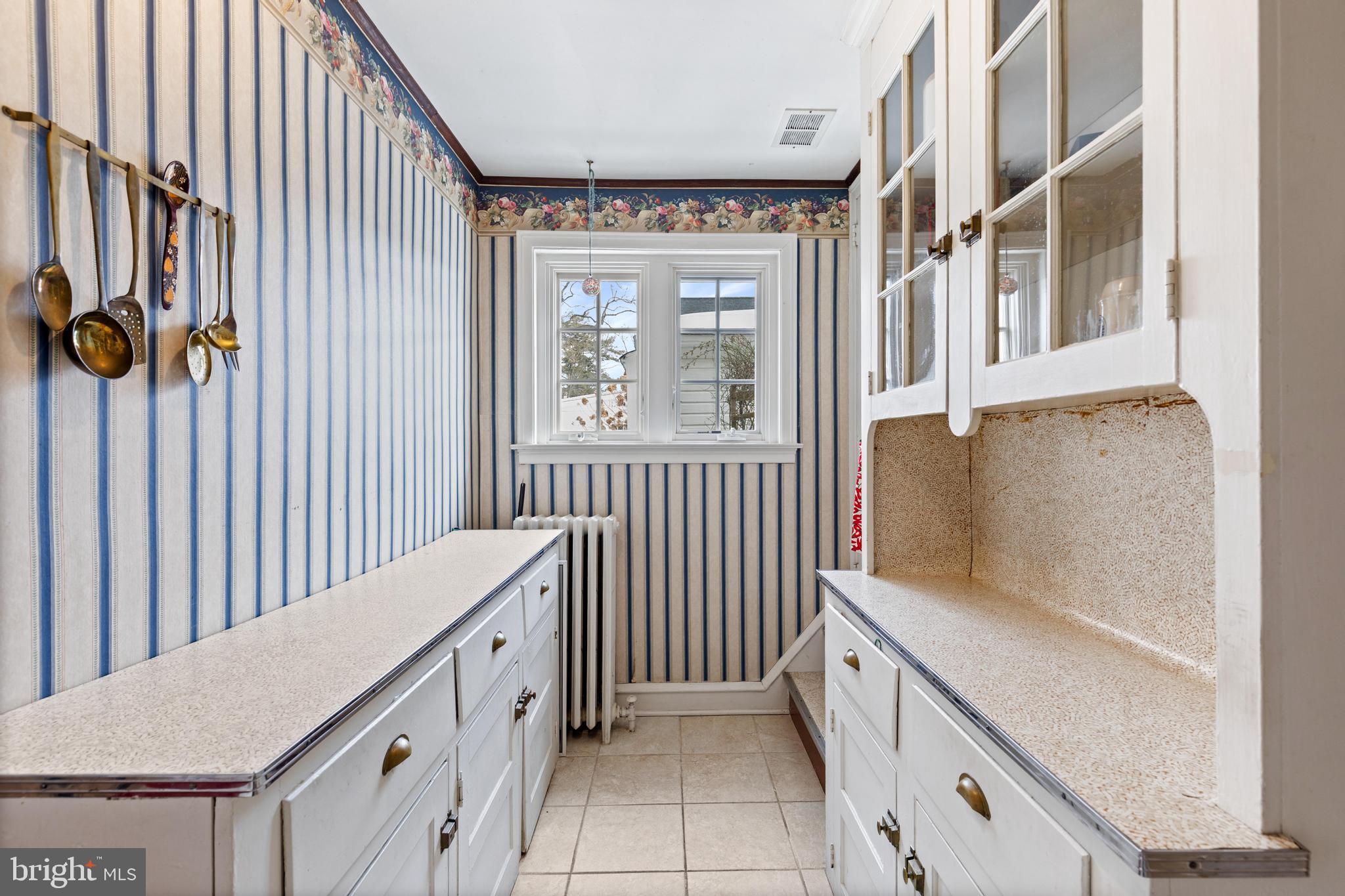 506 Spring Lane Wyndmoor, PA 19038 - Photo 11 of 29 a bathroom with a bathtub and a window