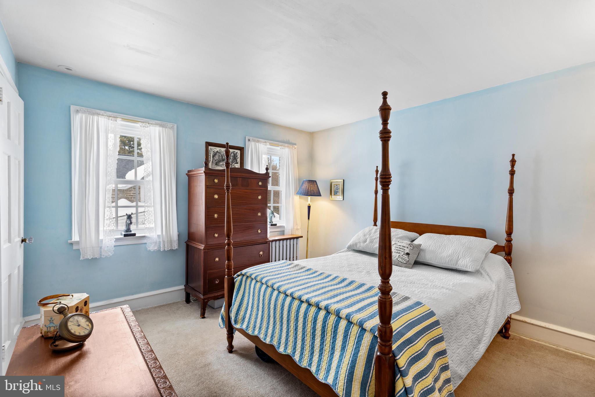 506 Spring Lane Wyndmoor, PA 19038 - Photo 18 of 29 a bedroom with a bed and wooden floor