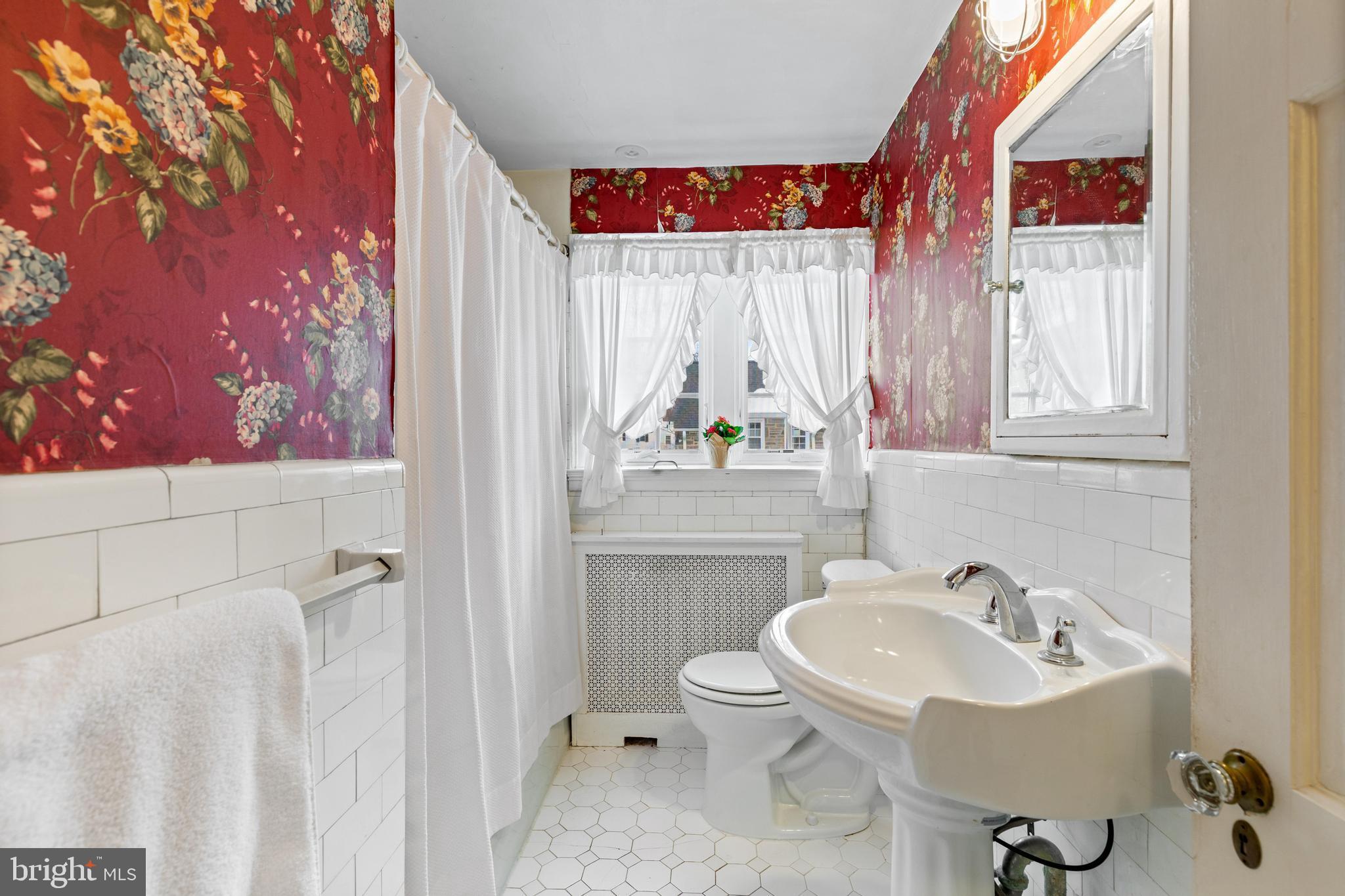 506 Spring Lane Wyndmoor, PA 19038 - Photo 19 of 29 a bathroom with a sink and a mirror