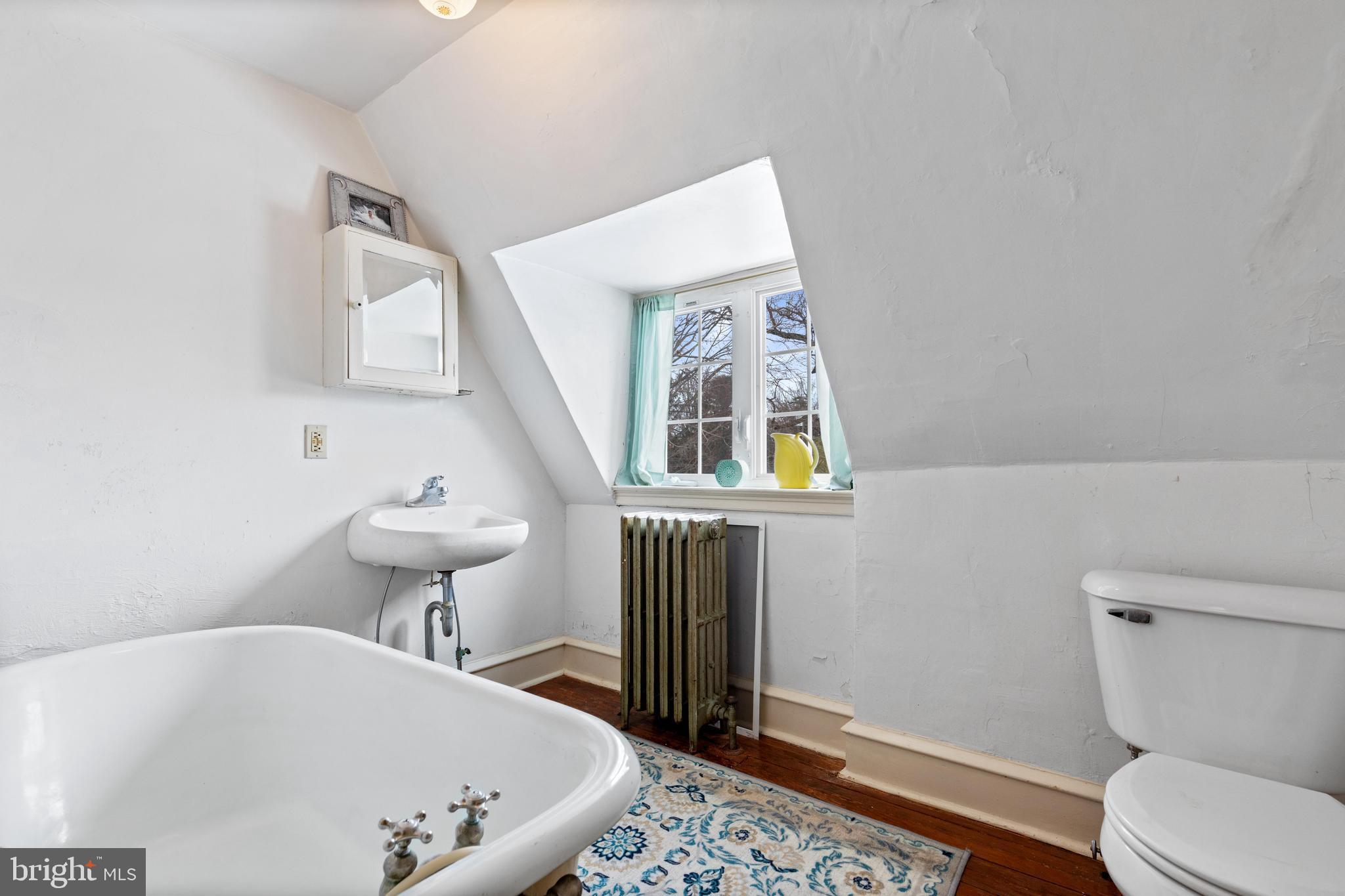 506 Spring Lane Wyndmoor, PA 19038 - Photo 25 of 29 a bathroom with a sink toilet and a mirror
