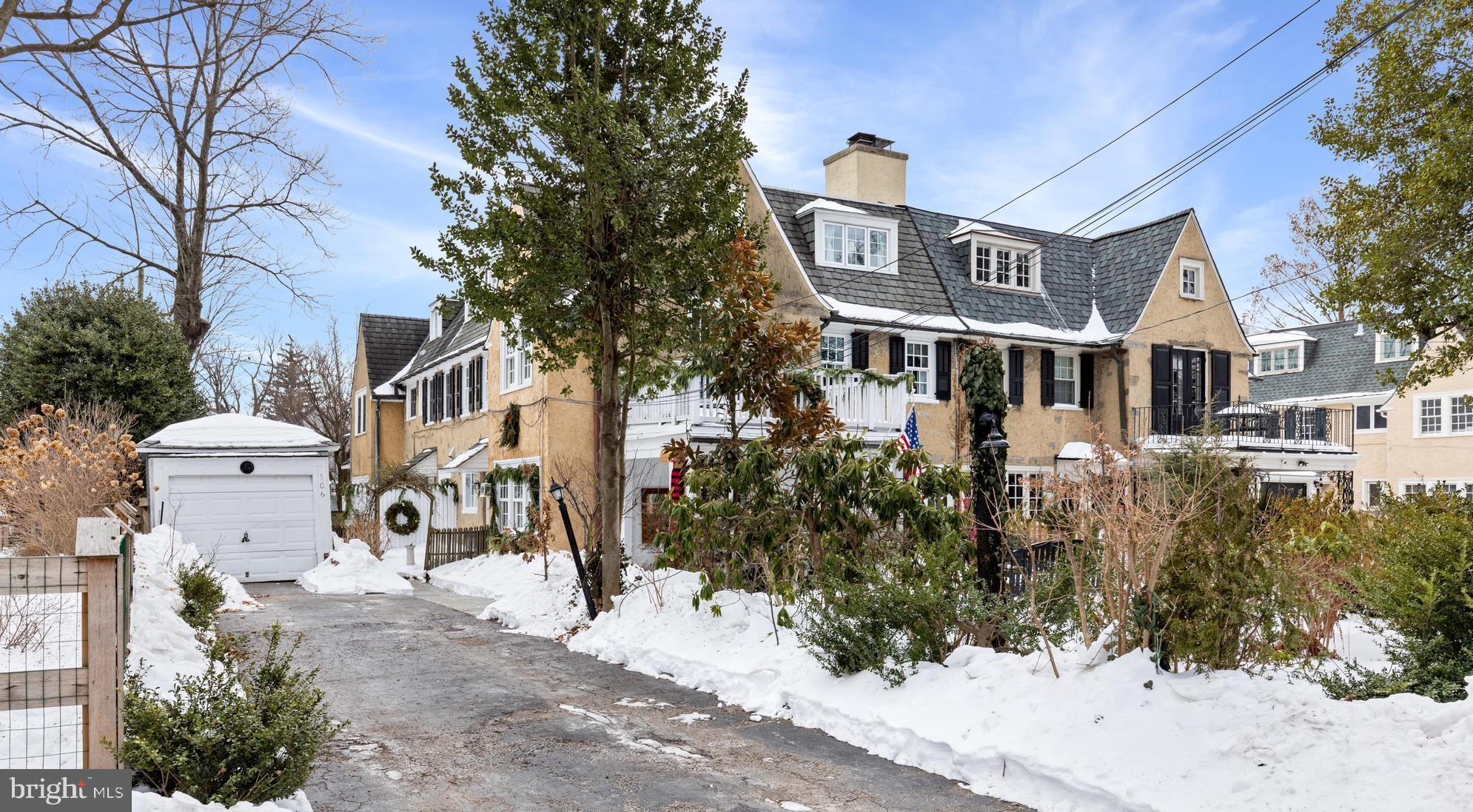 506 Spring Lane Wyndmoor, PA 19038 - Photo 3 of 29 a front view of a house with a yard and garage