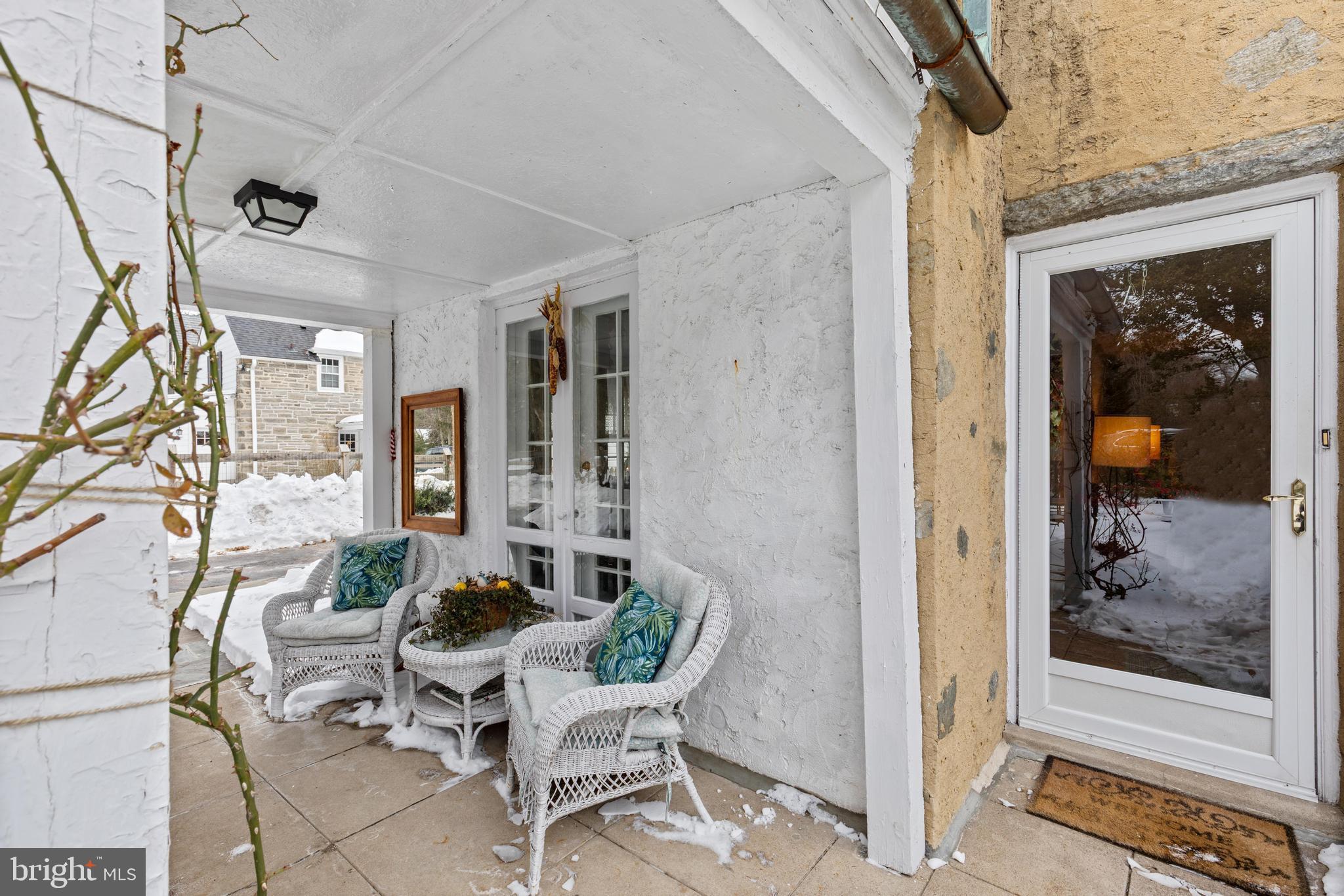 506 Spring Lane Wyndmoor, PA 19038 - Photo 5 of 29 a outdoor space with patio the couches and a dining table with wooden floor