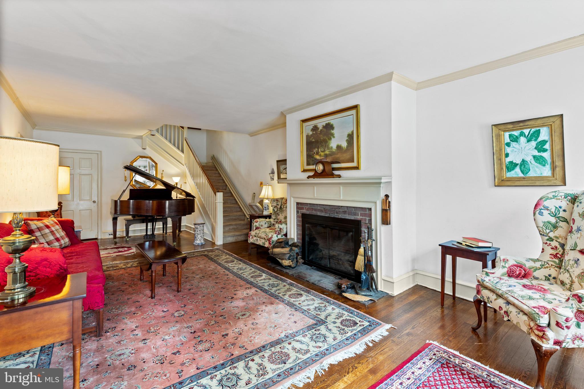 506 Spring Lane Wyndmoor, PA 19038 - Photo 8 of 29 a living room with furniture and a fireplace