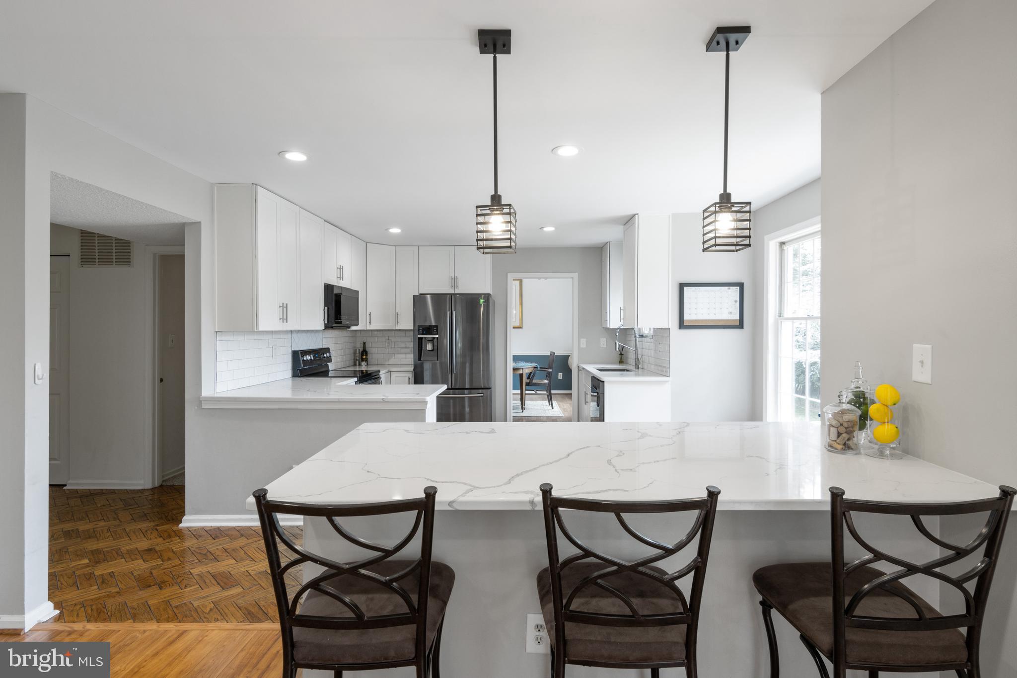 213 Hunters Ridge Road Lutherville-Timonium, MD 21093 - Photo 13 of 40 Kitchen with Quartz Island with Pendant Lights