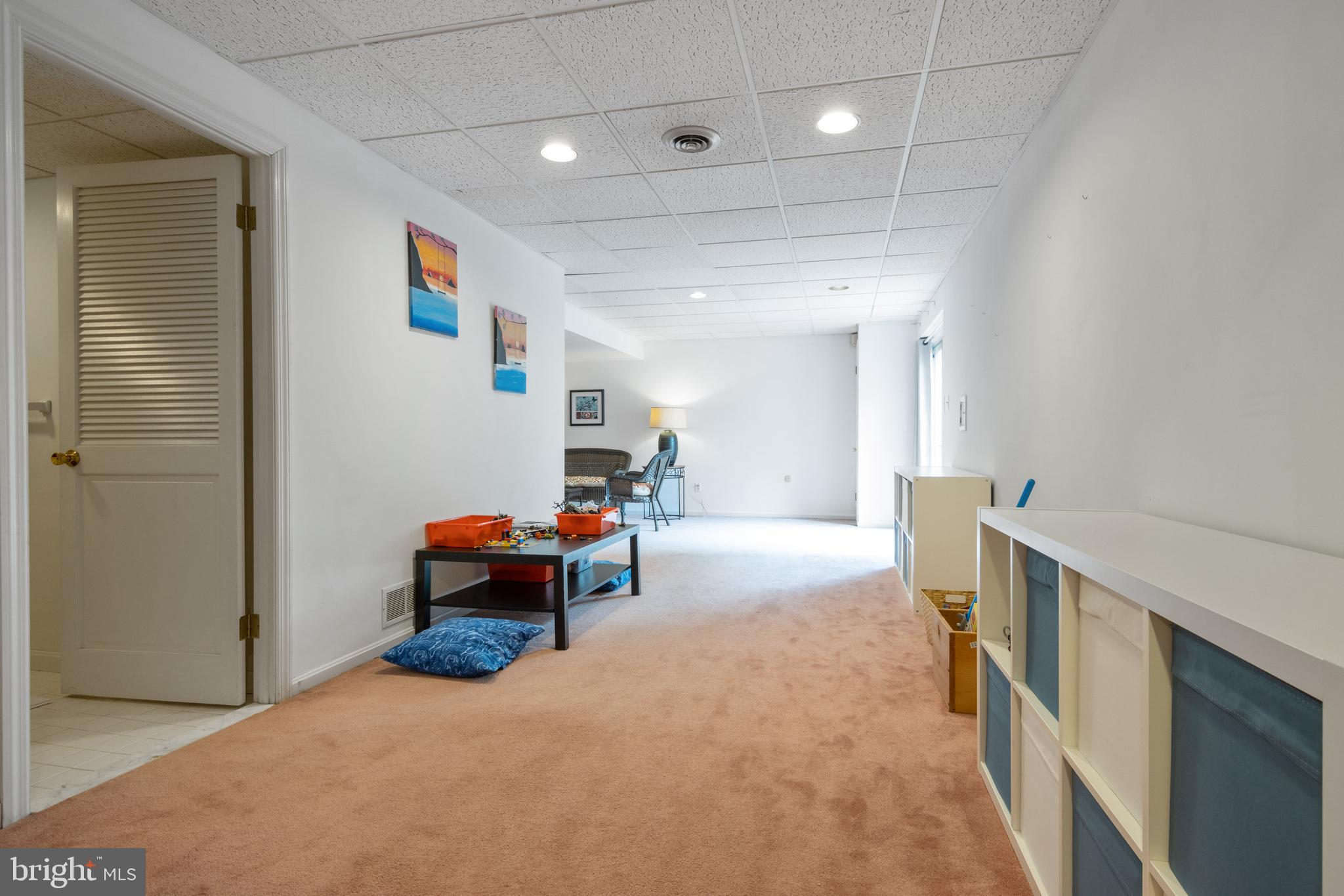 213 Hunters Ridge Road Lutherville-Timonium, MD 21093 - Photo 34 of 40 Playroom Area with Half Bath Access