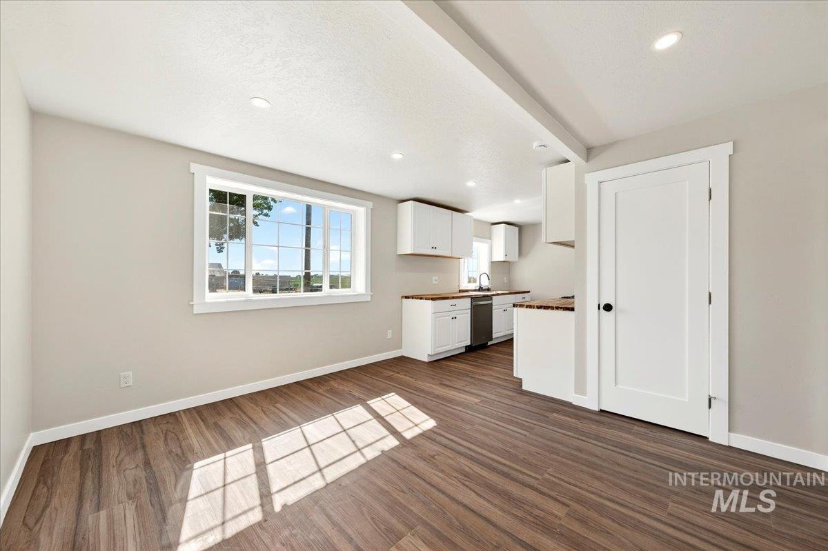 109 Parma Road Parma, ID 83660 - Photo 5 of 31 Open-concept living area with luxury plank flooring, recessed lighting, and a large, bright window