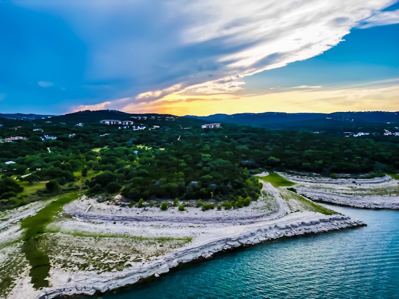 None Border Street Lago Vista, TX 78645 - Photo 1 of 8 a view of a lake with a mountain