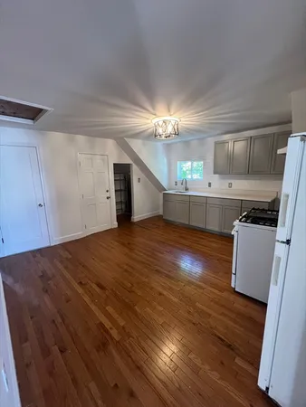 a view of cabinets and wooden floor