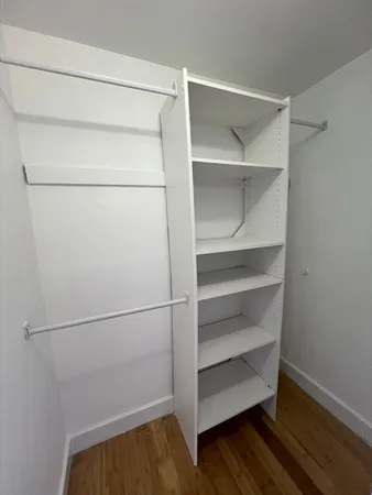 a view of an empty walk in closet