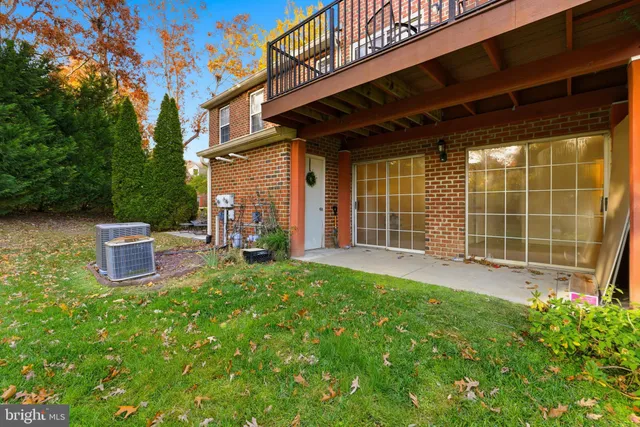 a view of a patio with table and chairs and potted plants