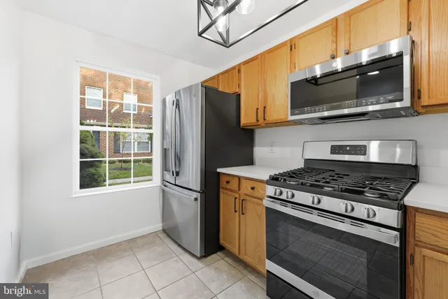 a kitchen with a stove microwave and refrigerator