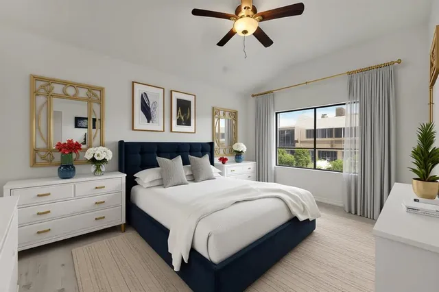 a bedroom with a large bed and a window