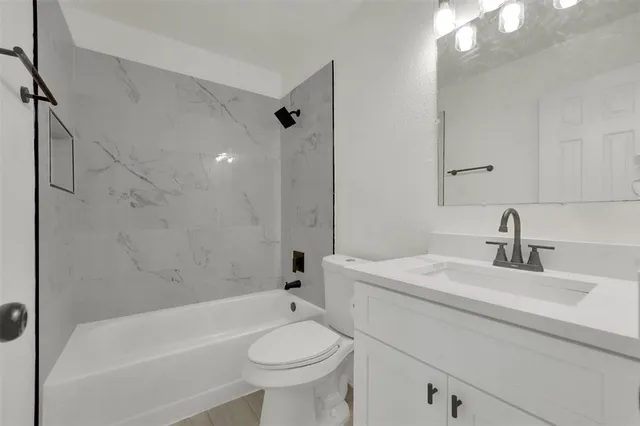 a bathroom with a sink a toilet and a bathtub