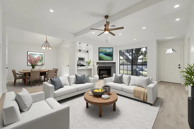 a living room with furniture and a fireplace